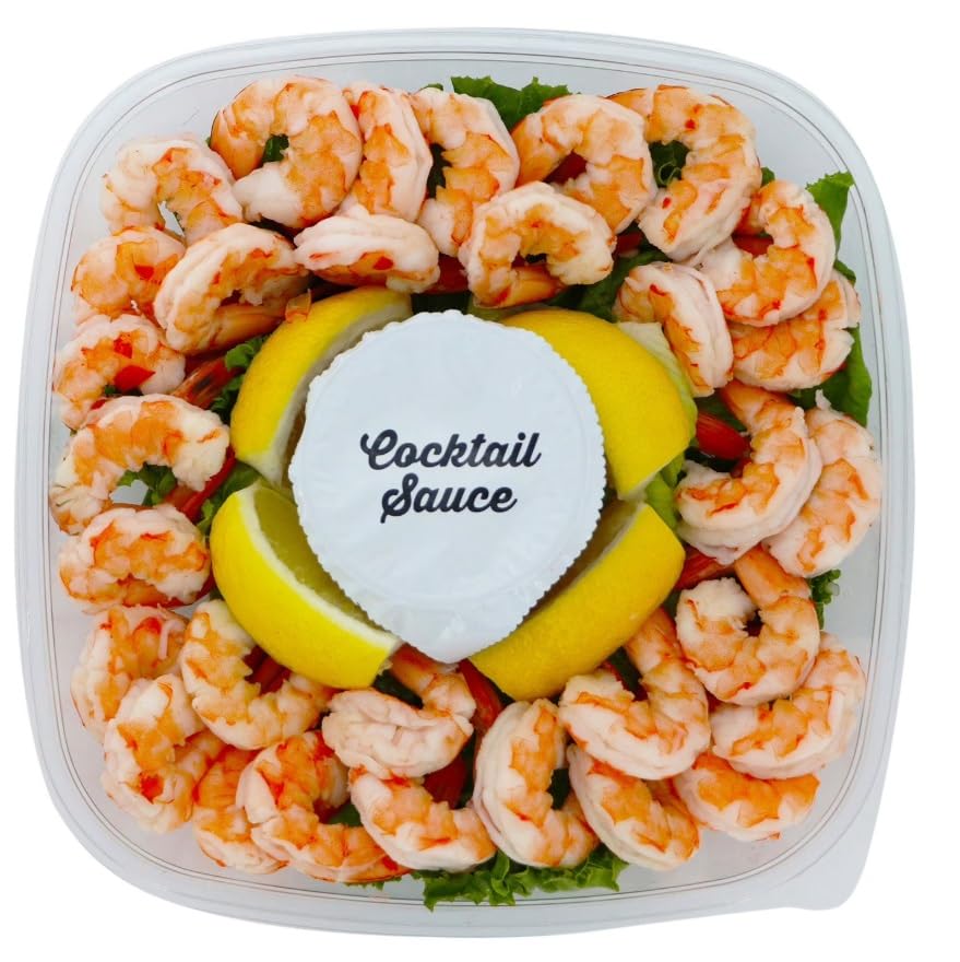 Shrimp Tray with Cocktail Sauce, Shrimp and zesty cocktail sauce in a party ready tray,It’s accompanied by fresh lemon wedges, adding a tangy twist to the dish. 1.5 POUND
