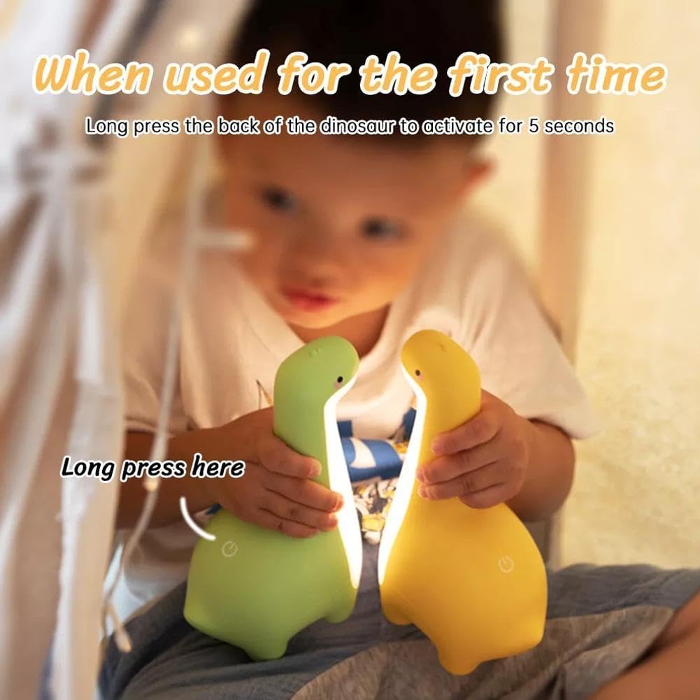 Child holding two dinosaur night lights, with an arrow pointing to the back of the dinosaur indicating where to long press for activation