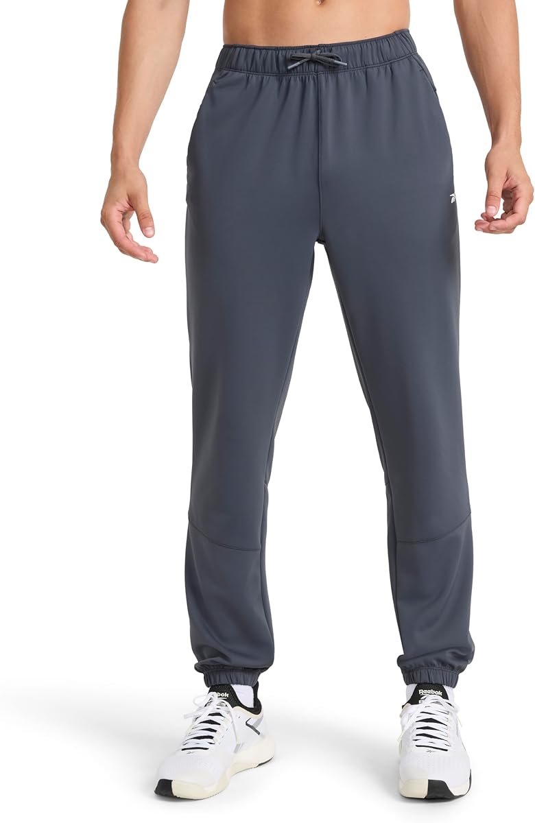 Pantalón Reebok Velocity para hombre, ajuste estándar, entrepierna de 31 pulgadas, tejido de buceo ligero y elástico Air Weave