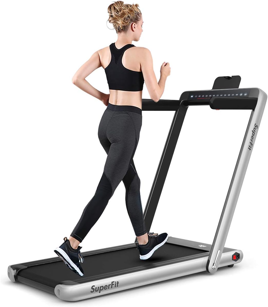 Woman running on the GYMAX Under Desk Treadmill with the handlebar raised.