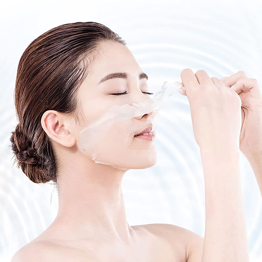 Person applying MINISO Lyocell Fiber Facial Mask