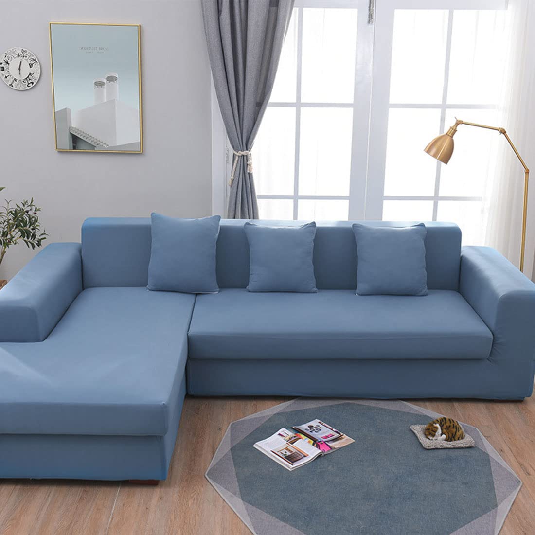 Housse de canapé en L bleu pour un salon moderne et chaleureux