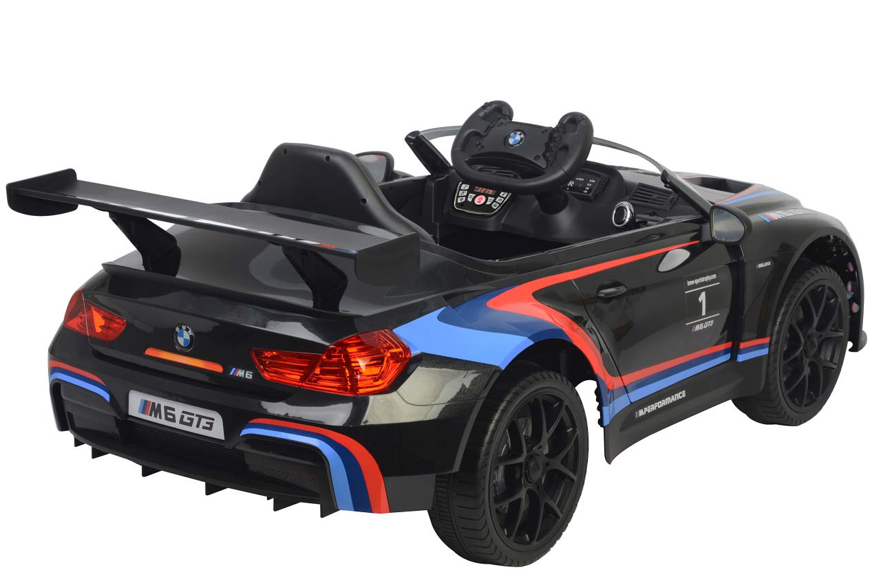 JAMARA 460474 – Ride-on BMW M6 GT3 – potenti motori di azionamento e batteria per lungo tempo di guida, 3 marce, ammortizzatore, connettore AUX, anello in gomma ultra grip, faro LED, nero, grande