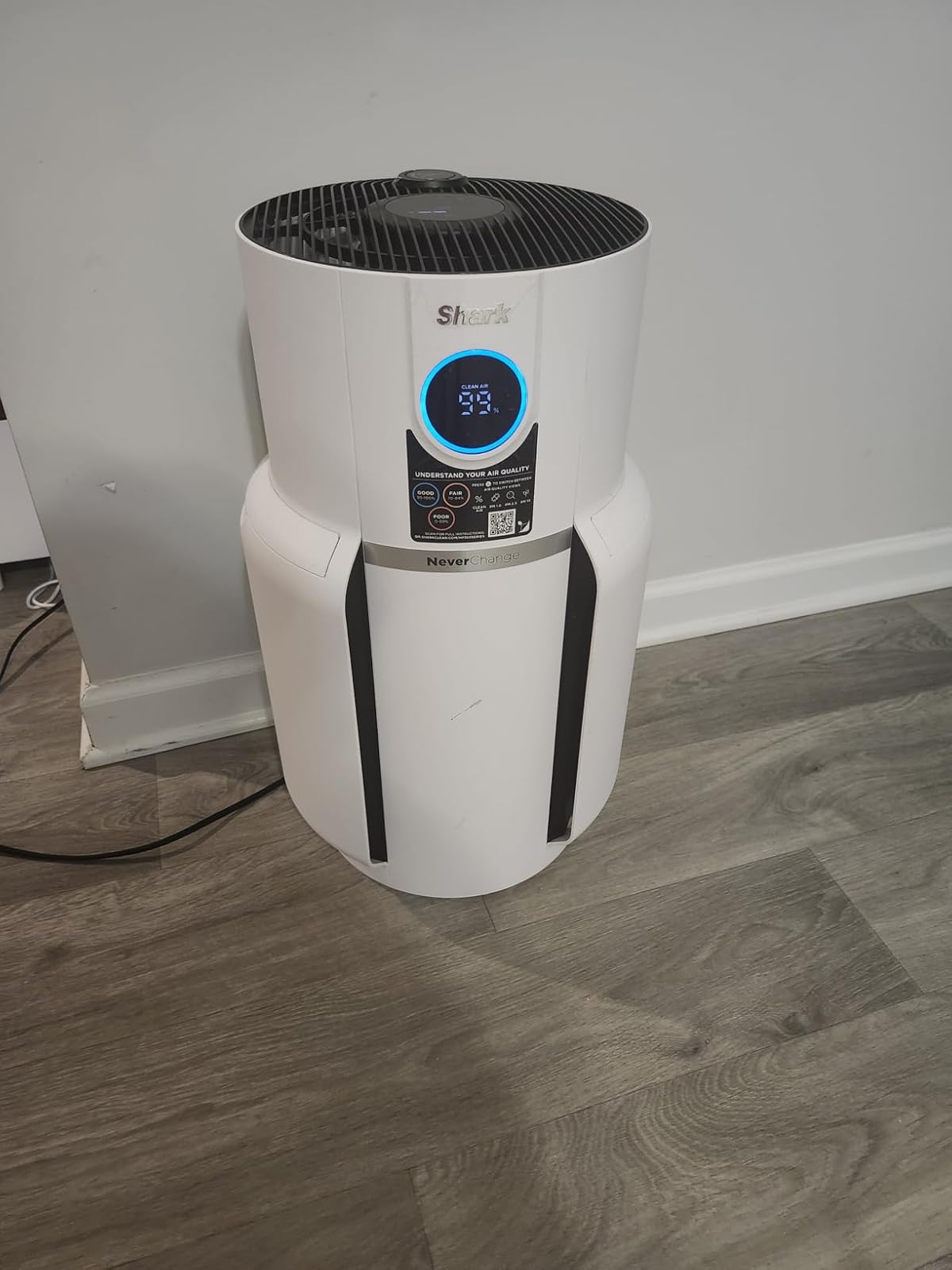 Shark NeverChange Air Purifier White model in living room with pet-friendly household setting
