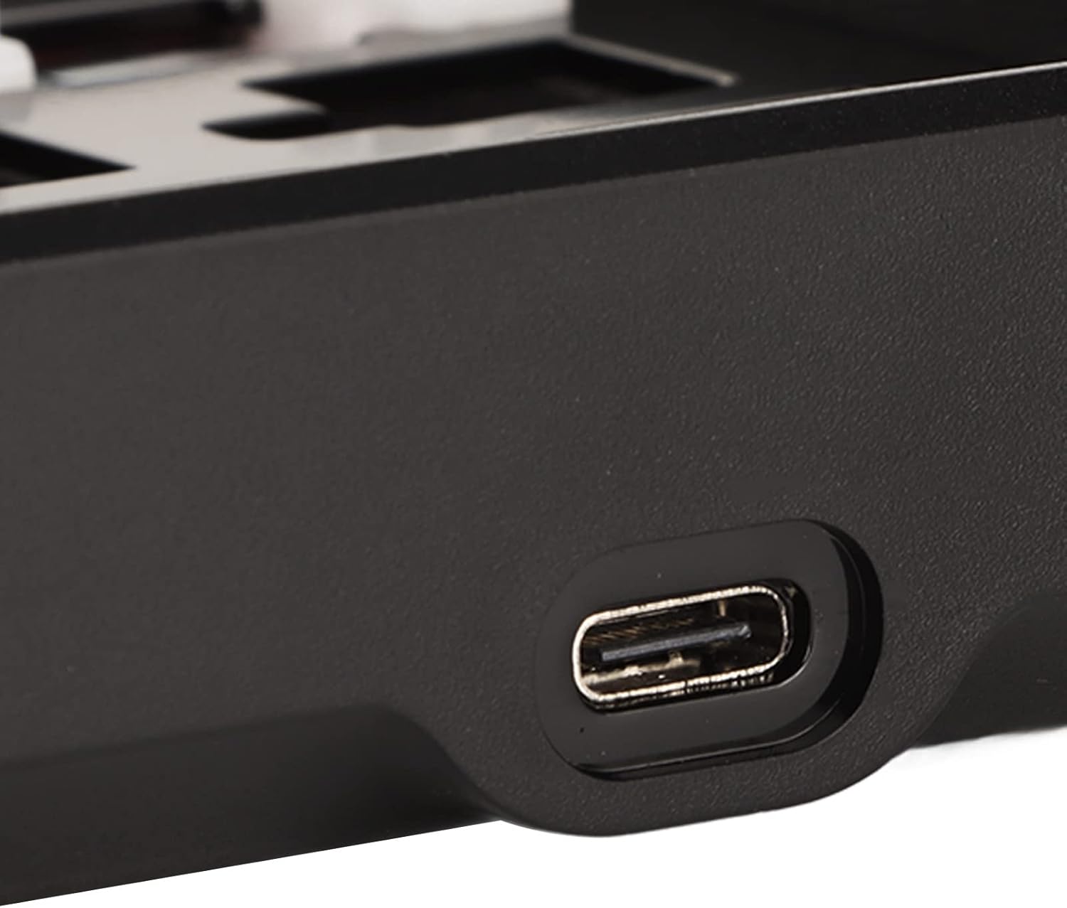 Close-up of the USB-C port on the ASHATA keyboard.