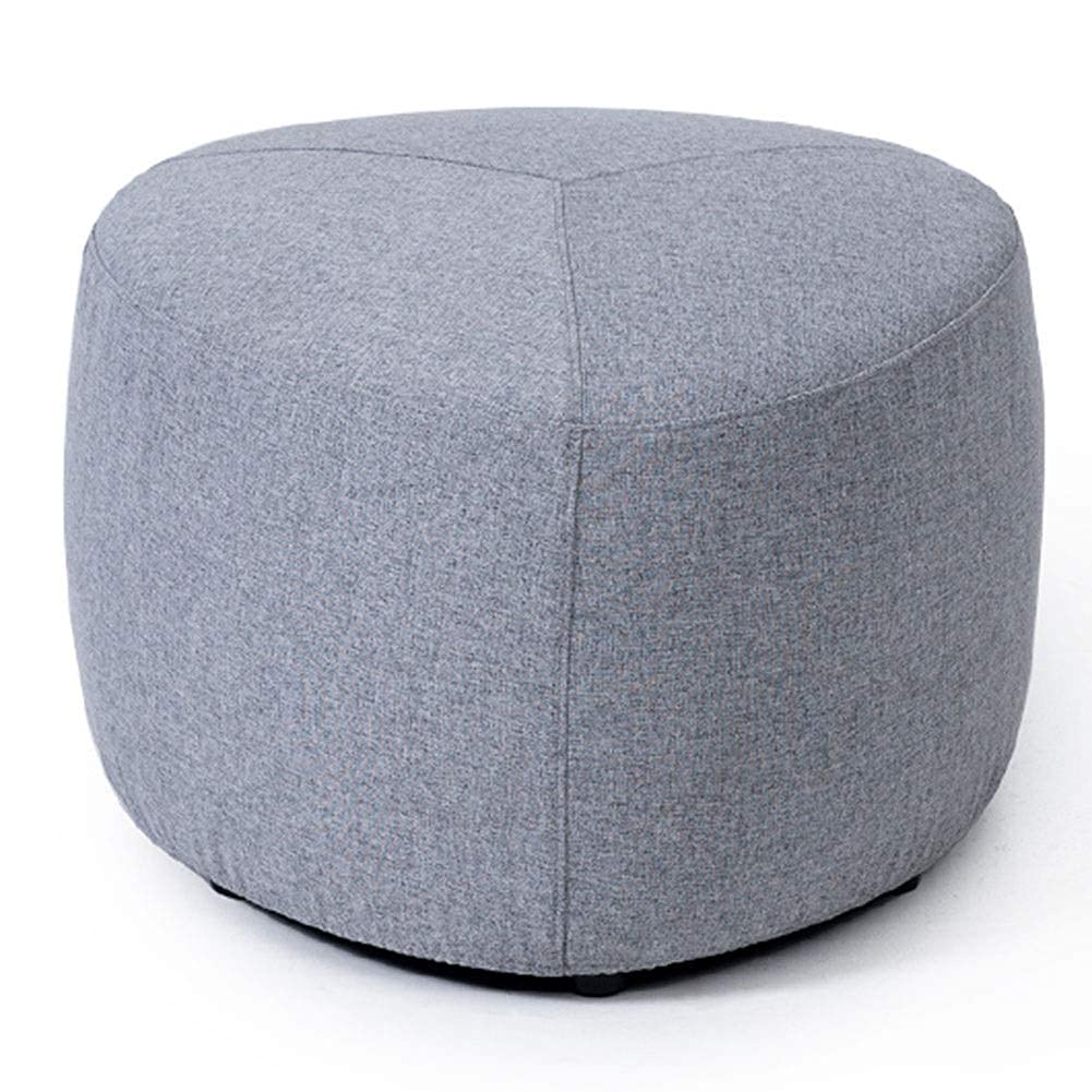 Pouf repose-pieds gris pour un salon chaleureux et modulable au quotidien
