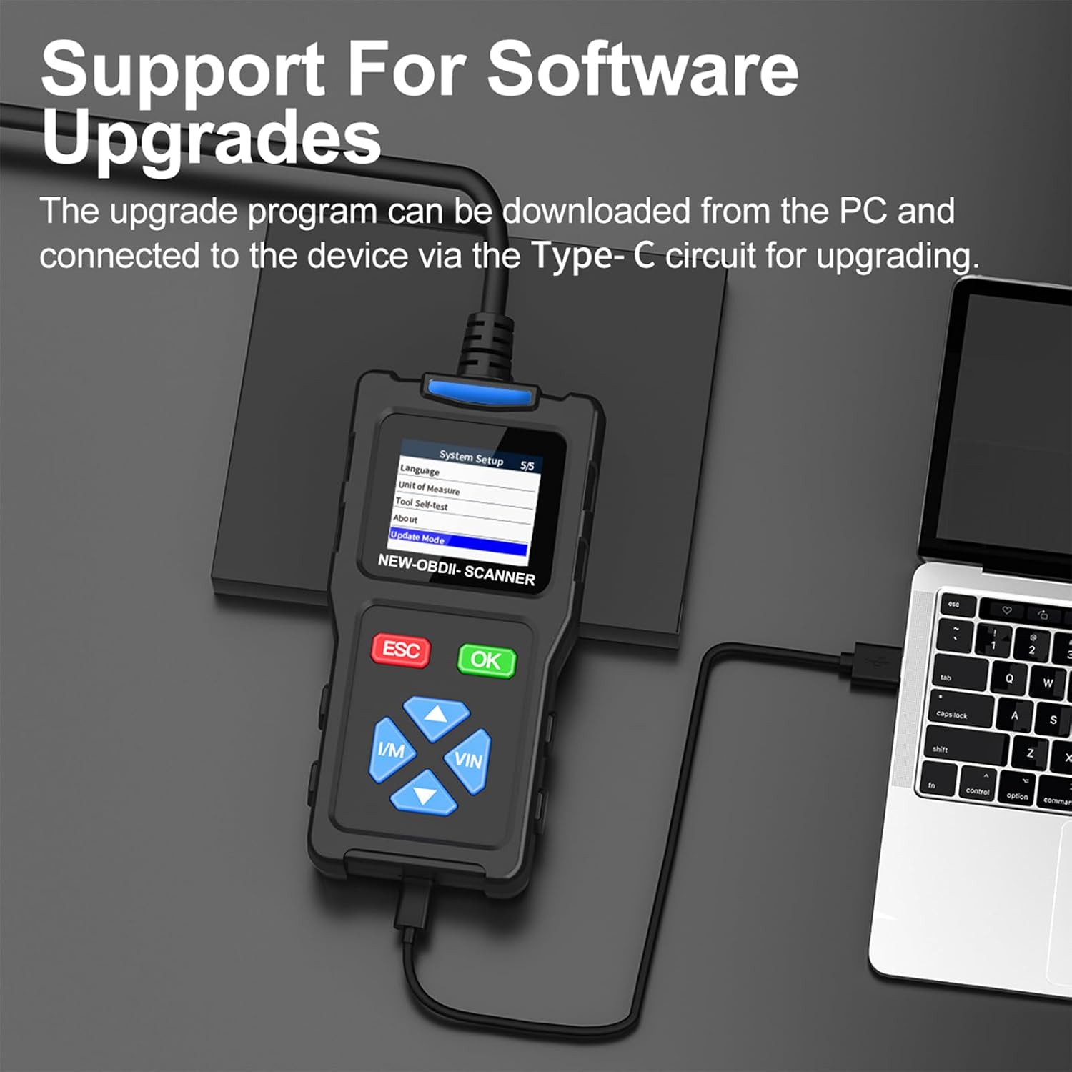 TopDiag T100 scanner connected to a laptop via USB-C cable for software upgrade