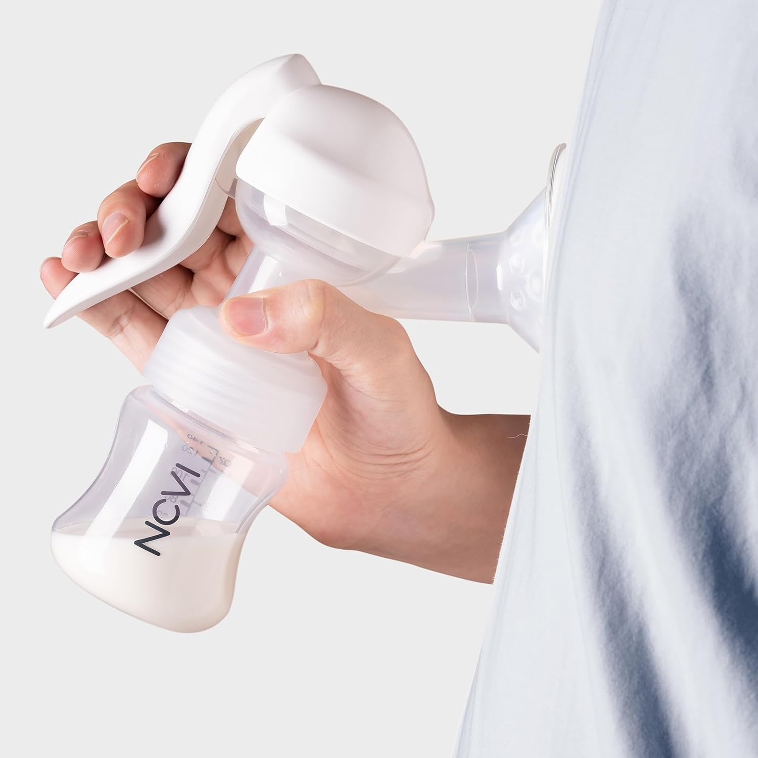 Person using the NCVI Manual Breast Pump