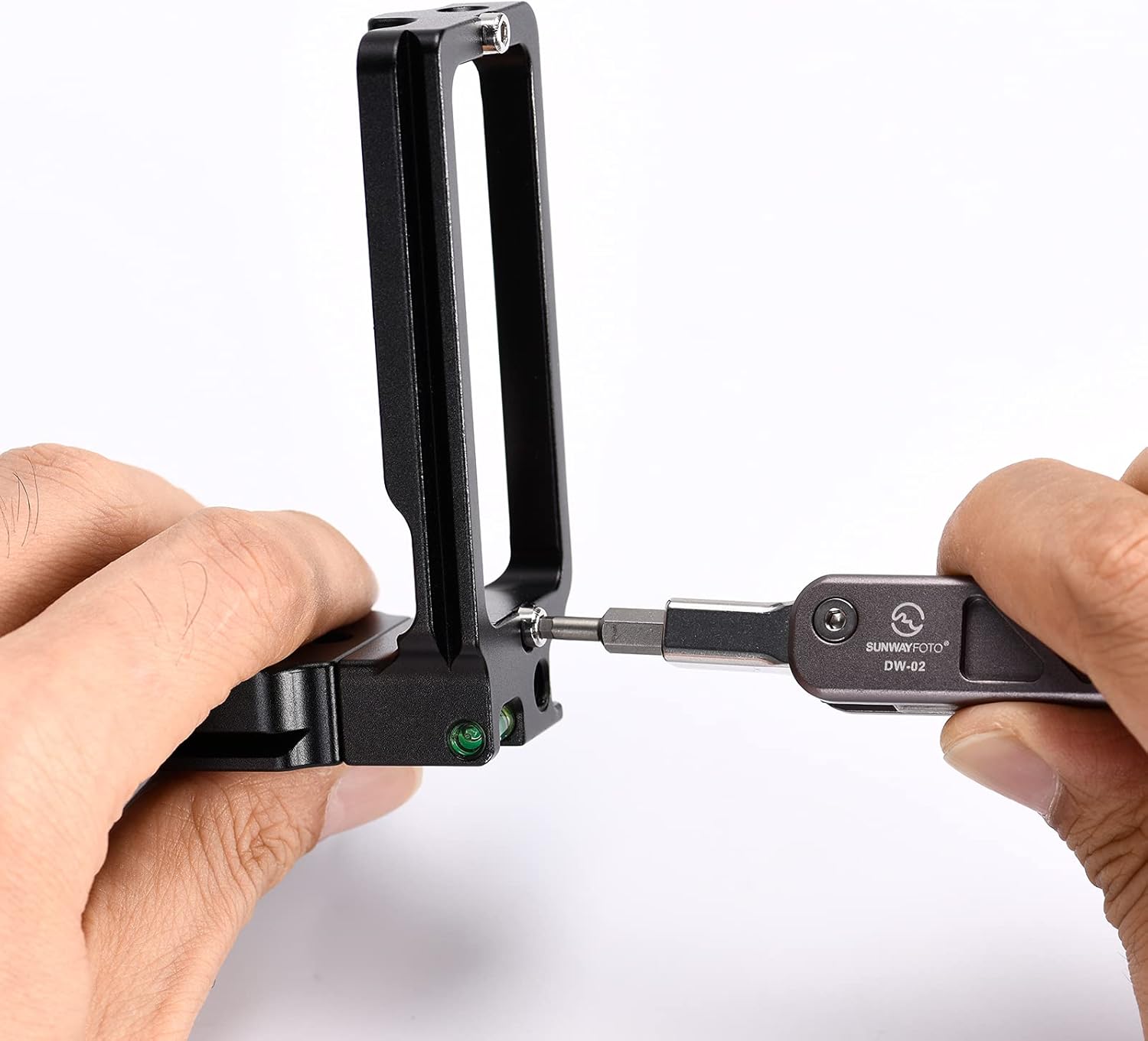 Close-up of the SUNWAYFOTO DW-02 tool showing a keychain attached to its integrated hole, illustrating a method to prevent loss.