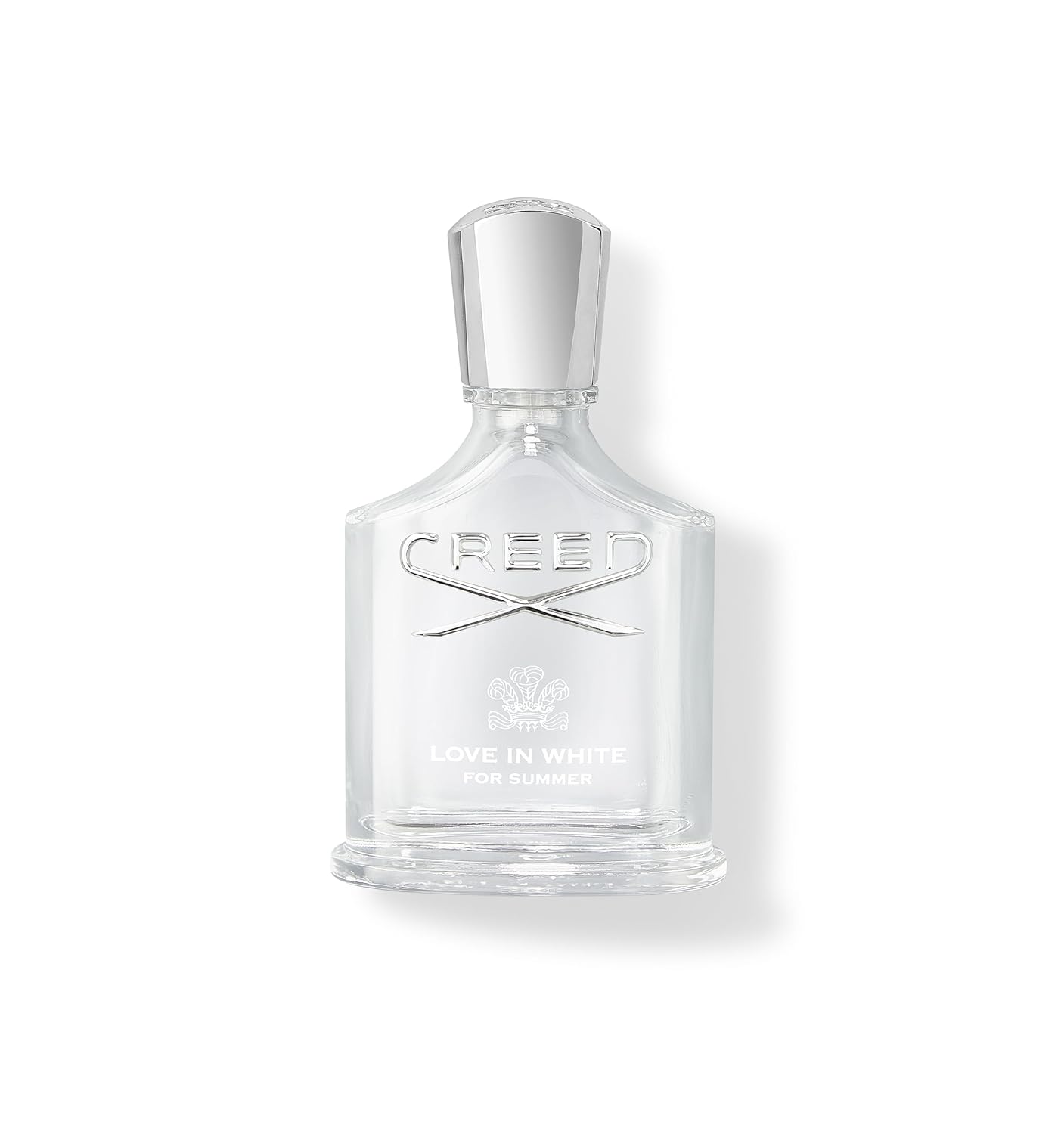 A bottle of luxury floral perfume on a clean white surface