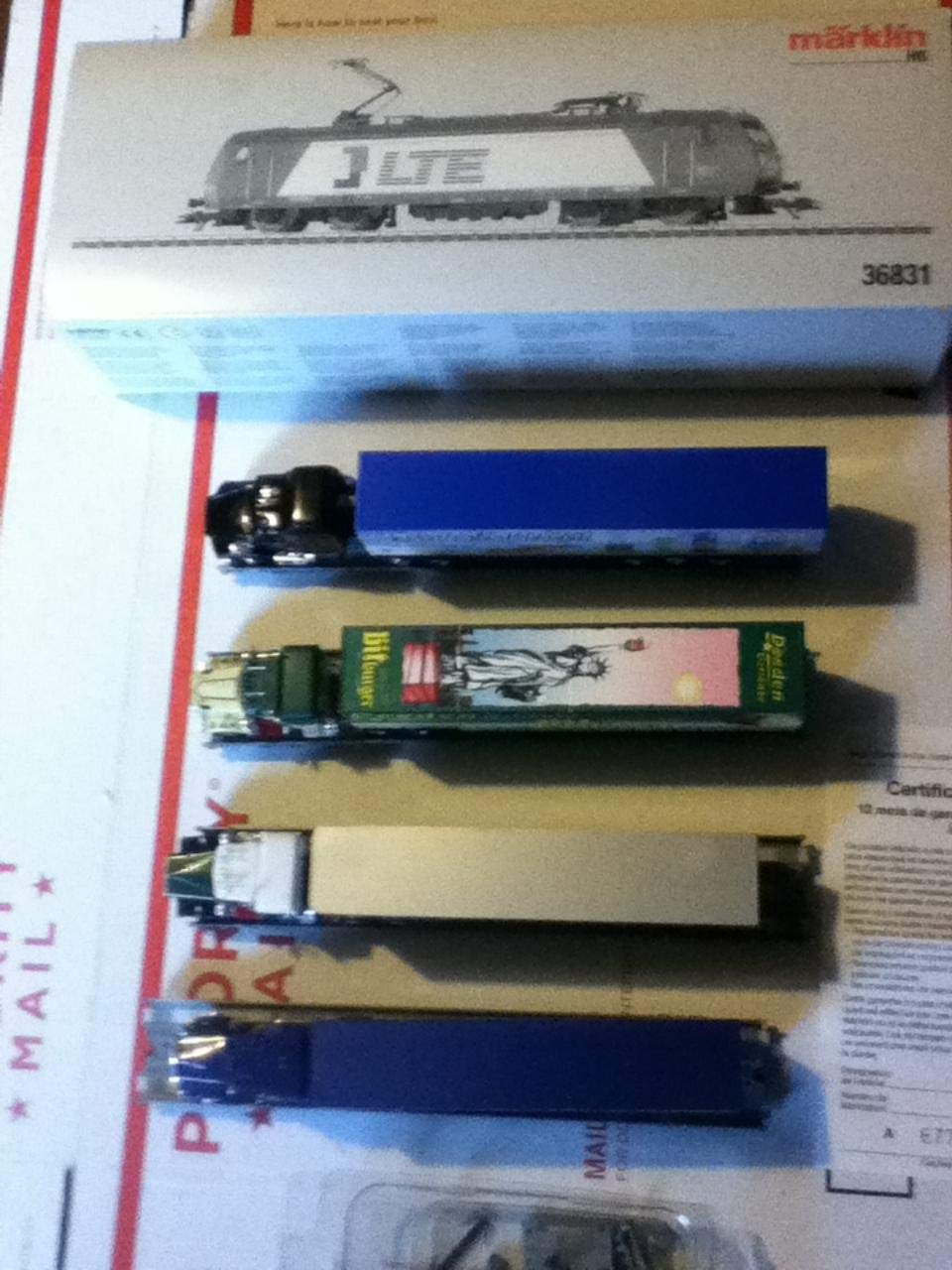 Märklin MARKLIN-HERPA HO Train Set LTE 36831 Digital DB Cast-Metal Electric BR-185 Locomotive W/4 Metal Depressed 8-AXELS Cars W/Assorted Scania-Trucks W/Trailers