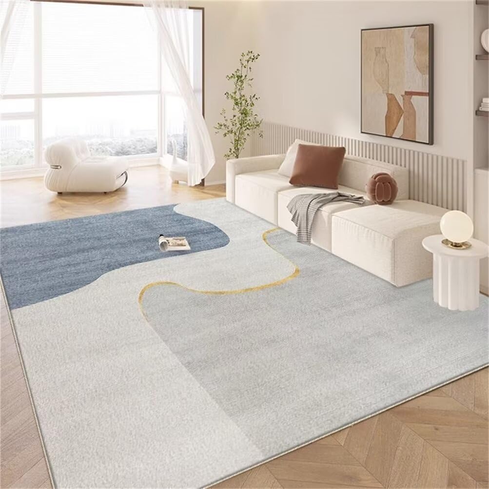 Petit canapé chambre ado complété par un tapis bleu