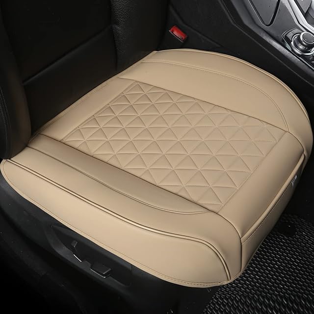 Black Panther front seat cushion cover in beige polyvinyl, showing wrap-around bottom design installed on a front driver's seat with the triangle quilted pattern and front pocket visible