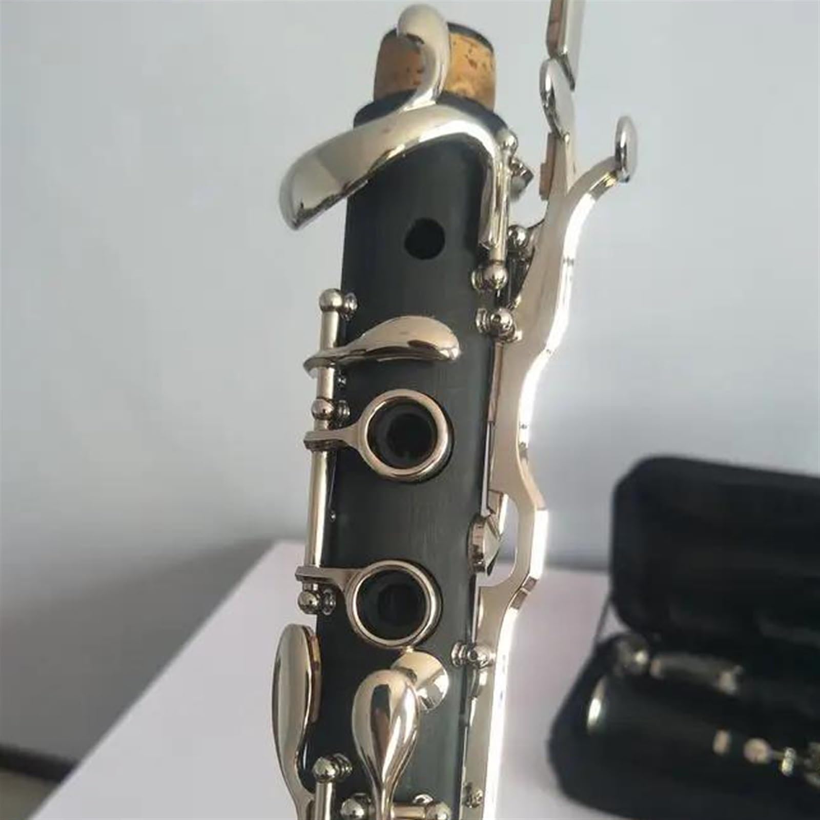 Instrumento de clarinete de 18 teclas en tecla G Cuerpo de baquelita Superficie niquelada Clarinete Profesional