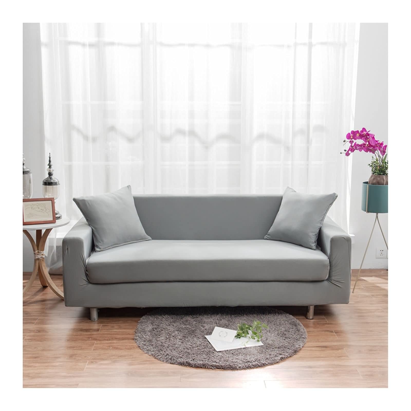 Housse canapé 2 places 145-185cm au design épuré gris clair uni