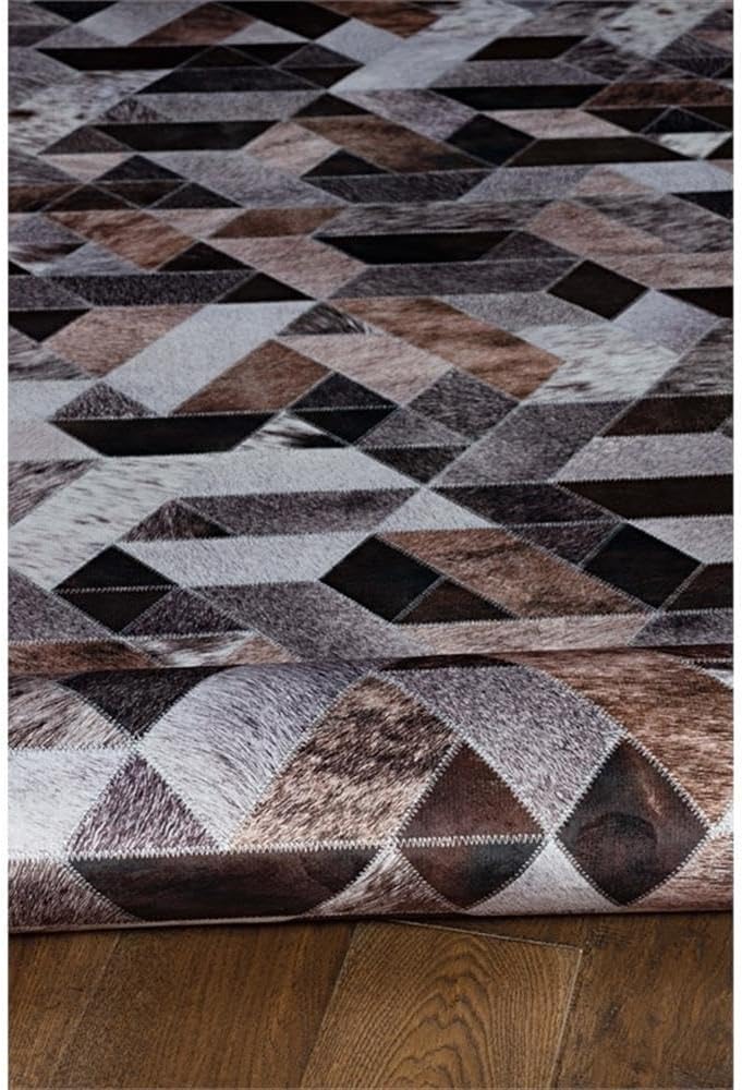 BOWERY HILL Patchwork Polyester Faux Cowhide 5' X 7' Area Rug in Brown