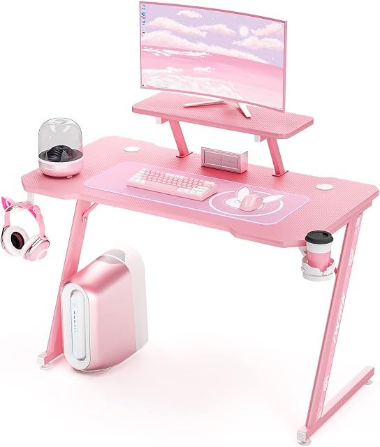 Intimate WM Heart Gaming Desk, 110cm Large Ergonomic Gaming Computer Desk, Carbon Fiber Table Top, E-Sports Desk with Adjustable Monitor Shelf, Rotatable Earphone, Cup, Handle Holders (Pink)