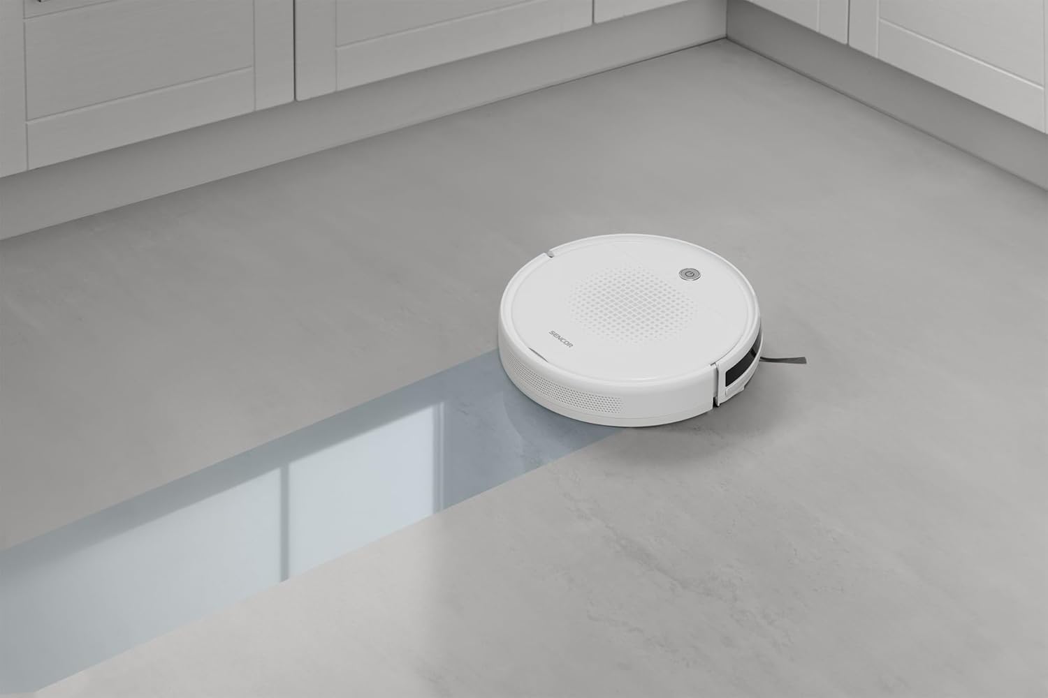 Sencor robot vacuum mopping a hard floor