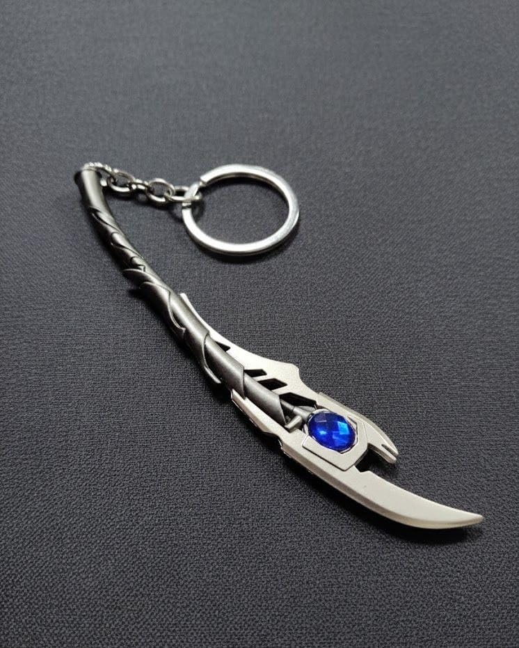 Image of Metal Sword Keychain with Blue Gem, Silver, Twisted Handle Design, Dagger Style Accessory