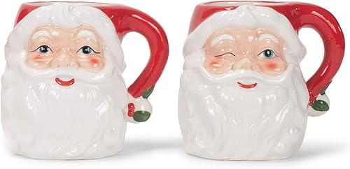 Transpac Juego de 2 tazas navideñas de cerámica de dolomita con caras de Papá Noel sonriente y guiñando un guiño vintage de 12 onzas