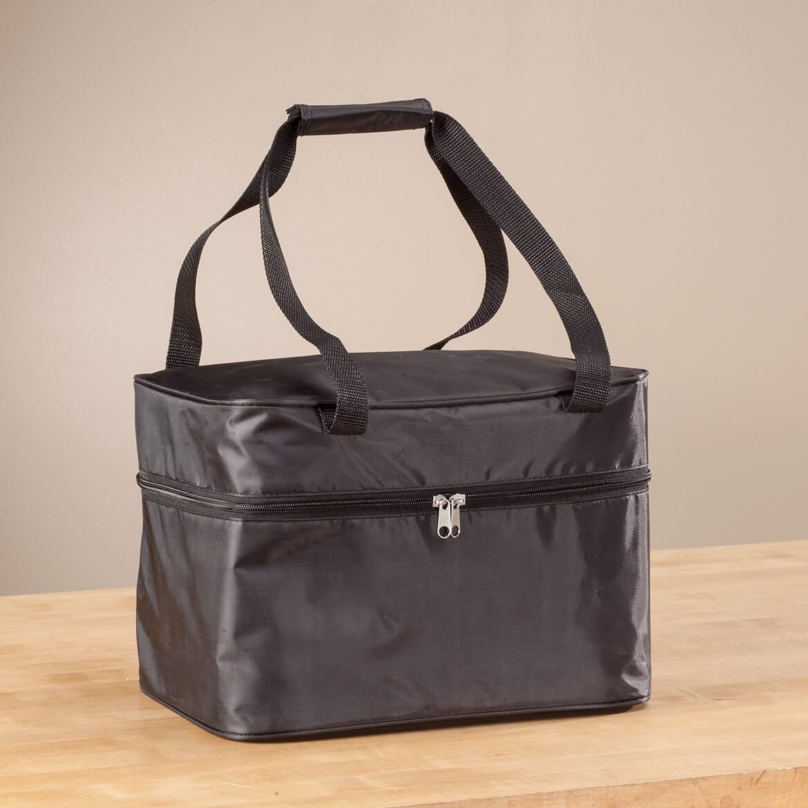 West Bend Slow Cooker griddle base with two pancakes cooking.