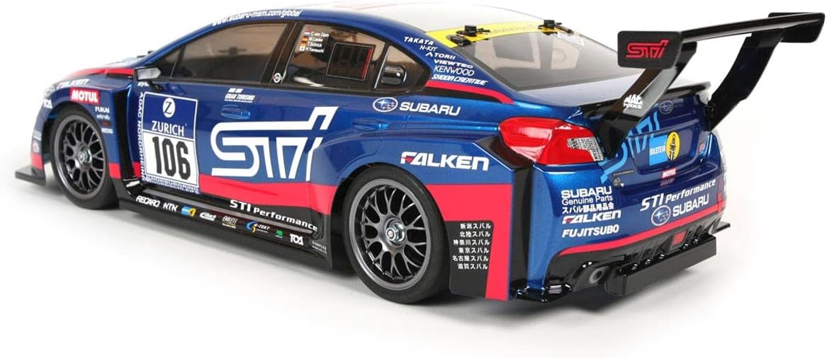 TAMIYA Subaru WRX STI TT-02 RC car, side view, highlighting its sleek design and gun metal mesh wheels.