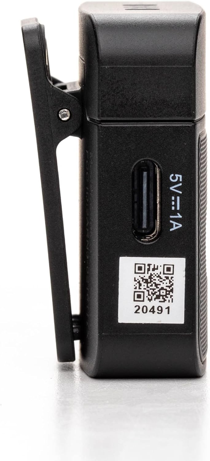 Hêl view of a Saramonic Blink 100 B6 transmitter, showing the mute button, power button, and gain/noise reduction controls.