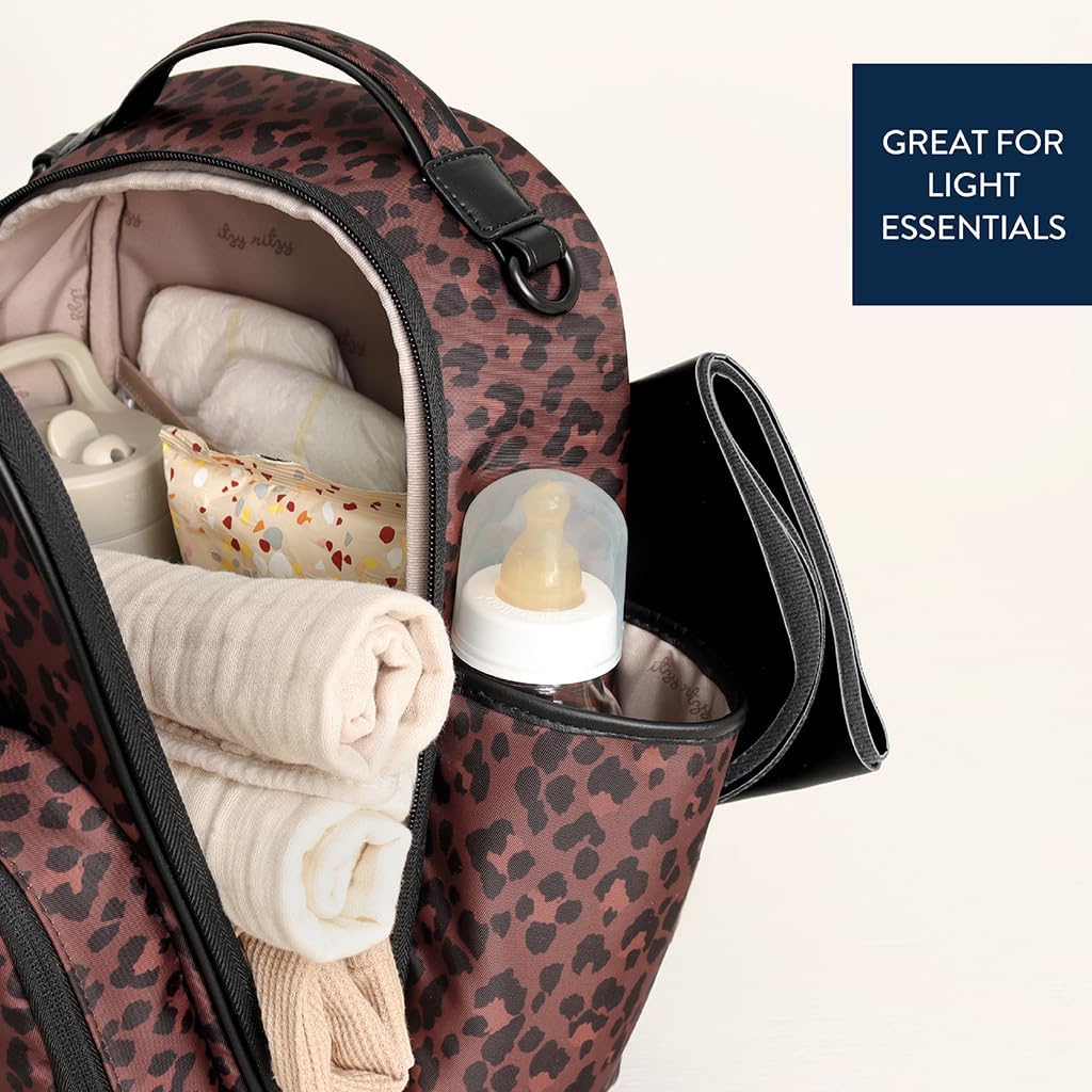 Itzy Ritzy Mini Diaper Bag Backpack – Chic, Compact Mini Plus Backpack with Changing Pad, 10 Pockets (6 Internal, 4 External), Grab-Top Handle & Rubber Feet – Leopard (Woven)