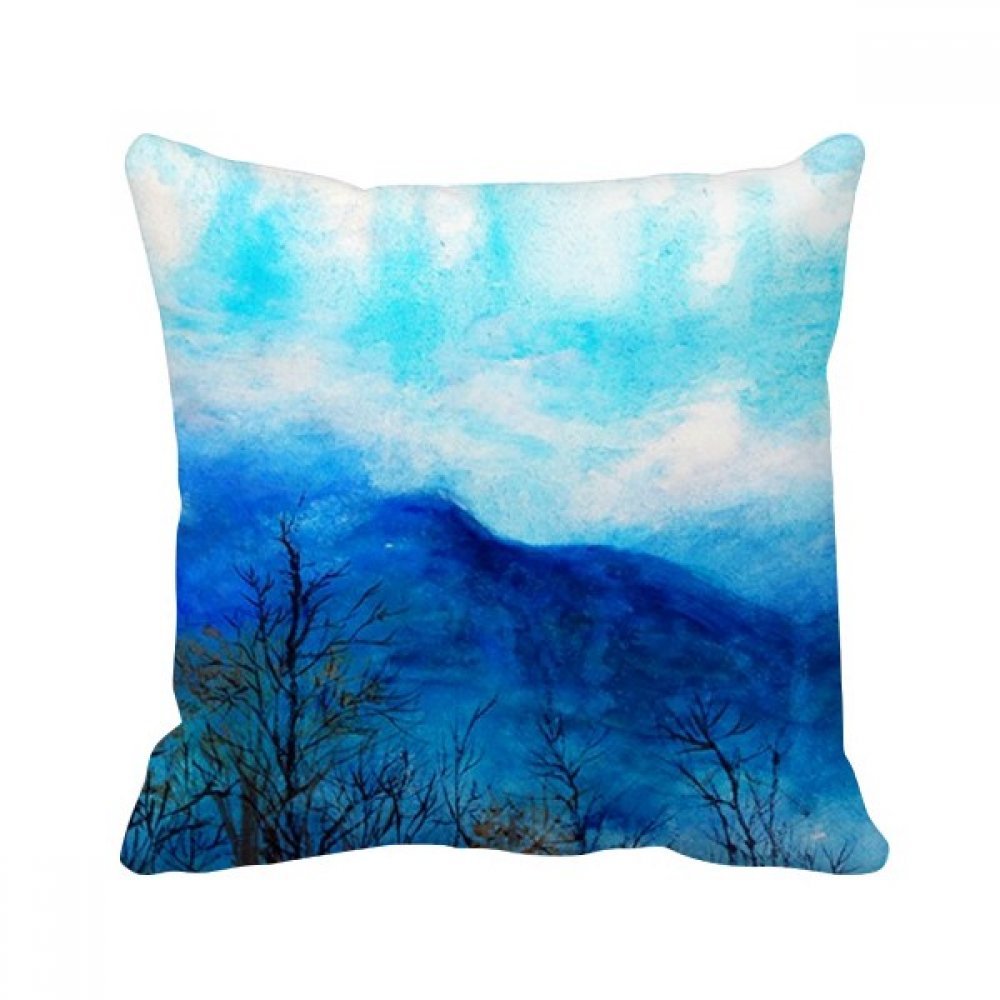 Coussin bleu art de montagne pour créer une ambiance cocooning sur votre canapé