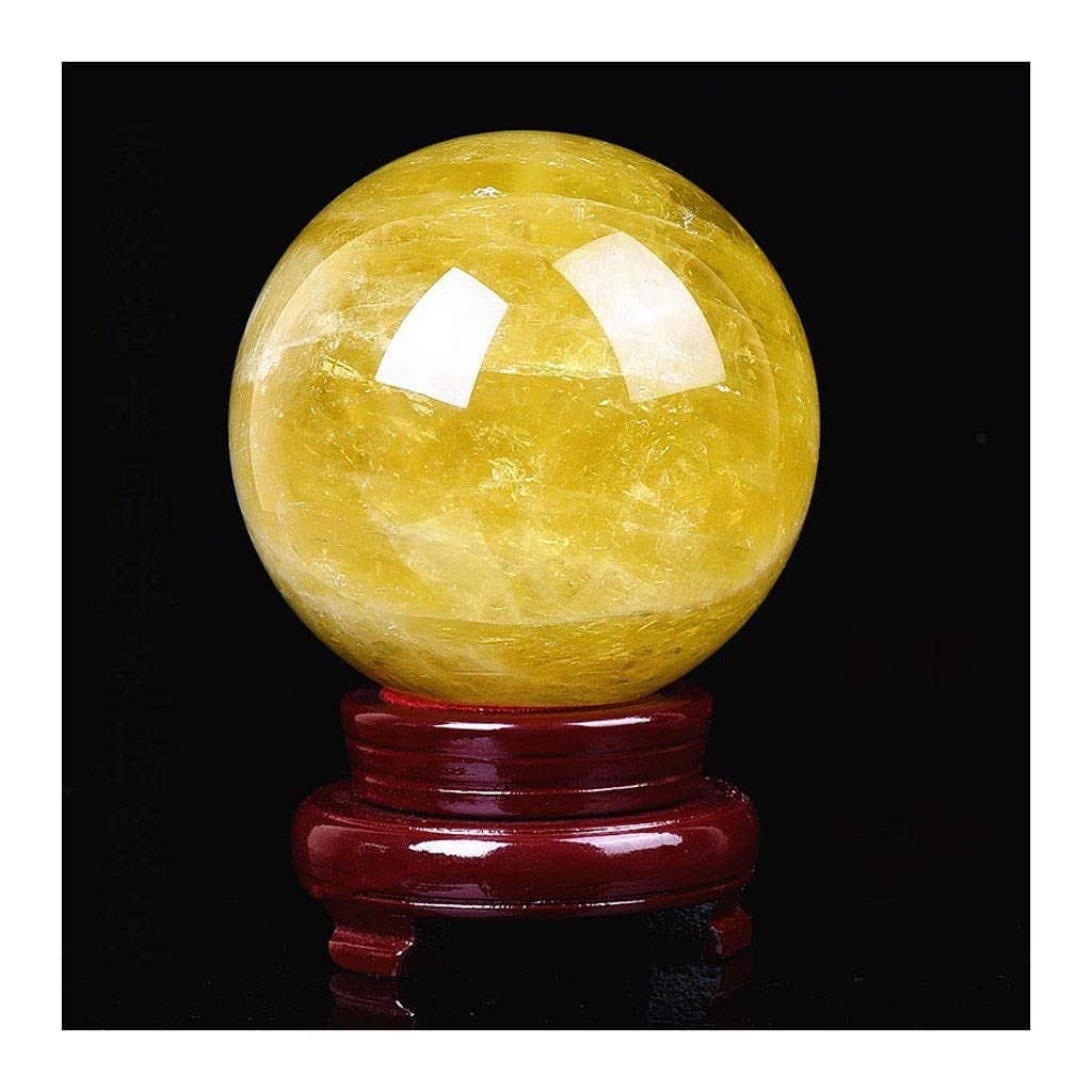 Boule de cristal feng shui en verre jaune pour harmoniser votre salon