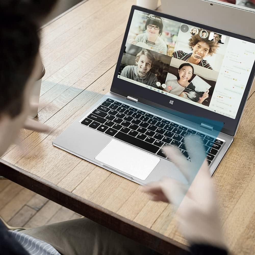 A person using the Iproda Laptop for a video conference call with multiple participants visible on the screen.