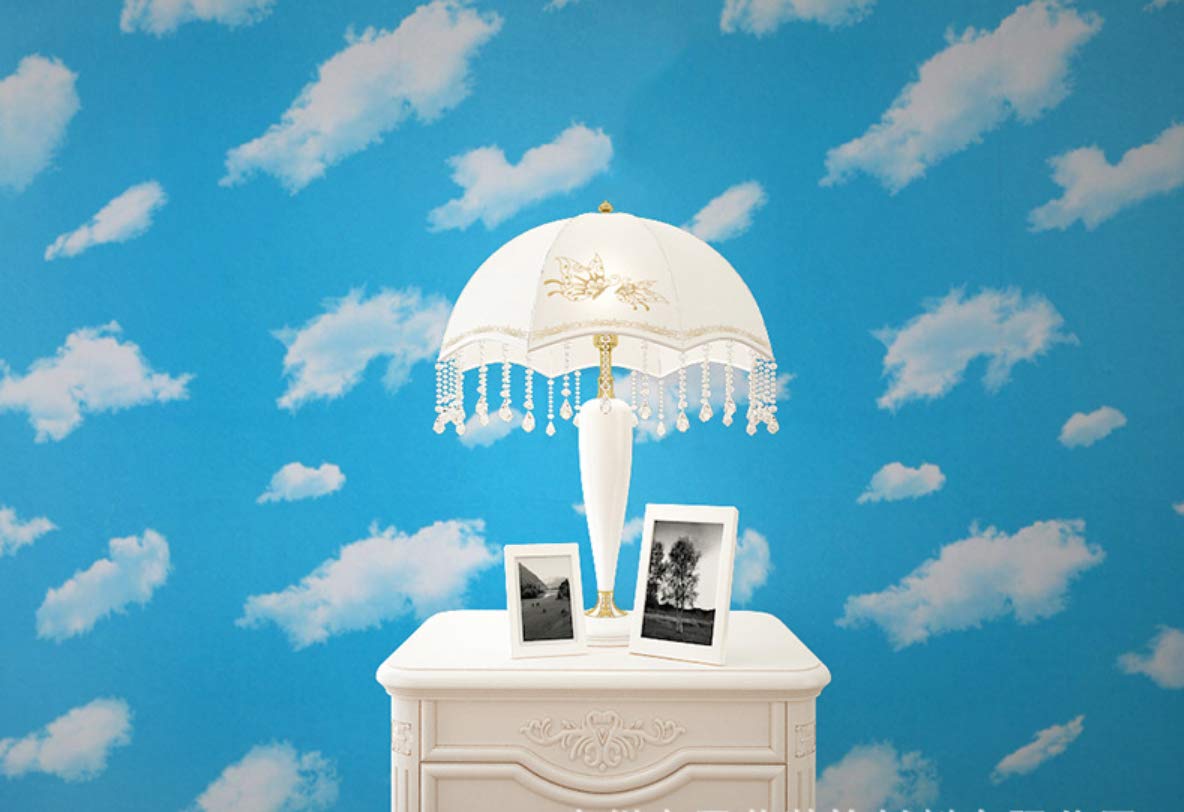 Papier peint ciel bleu pour cacher les défauts d'un plafond