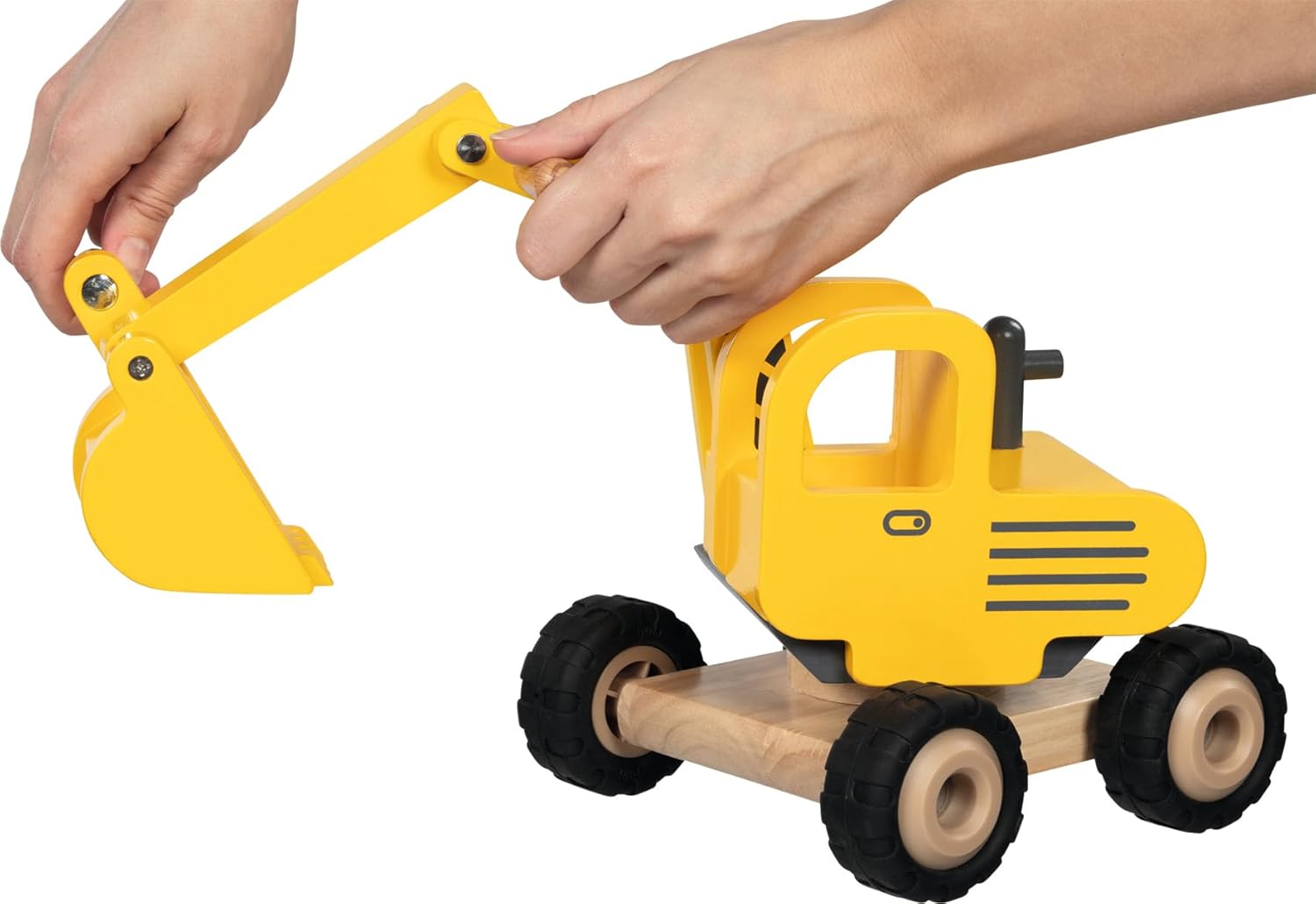 Hands operating the movable shovel of the goki wooden excavator
