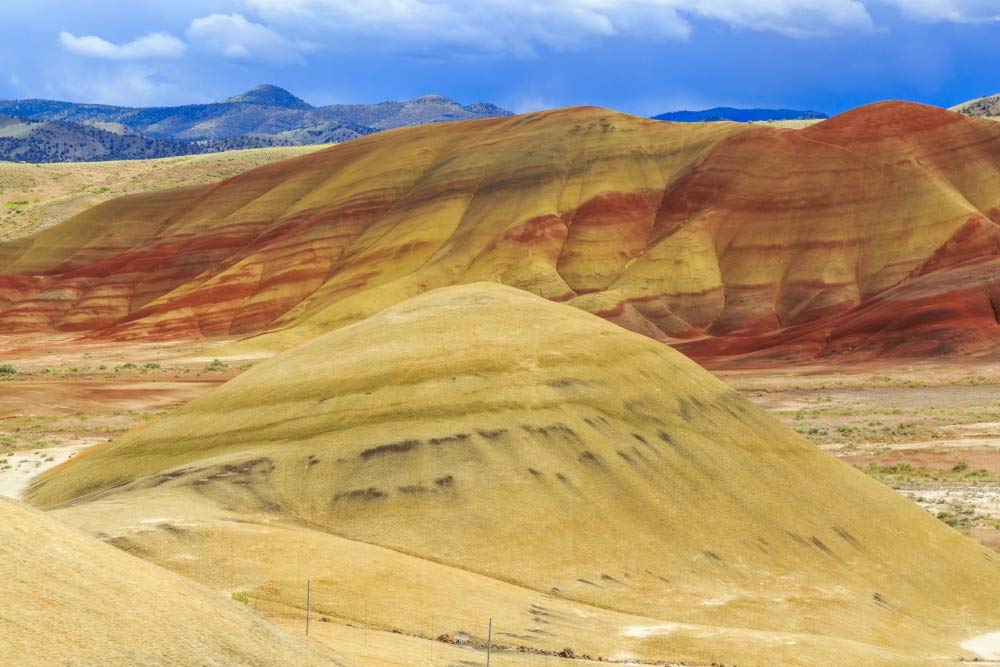 Central OR, Redmond, Bend, Mitchell. Series of low clay hills striped in colorful bands of minerals Poster Print by Emily Wilson (24 x 36)