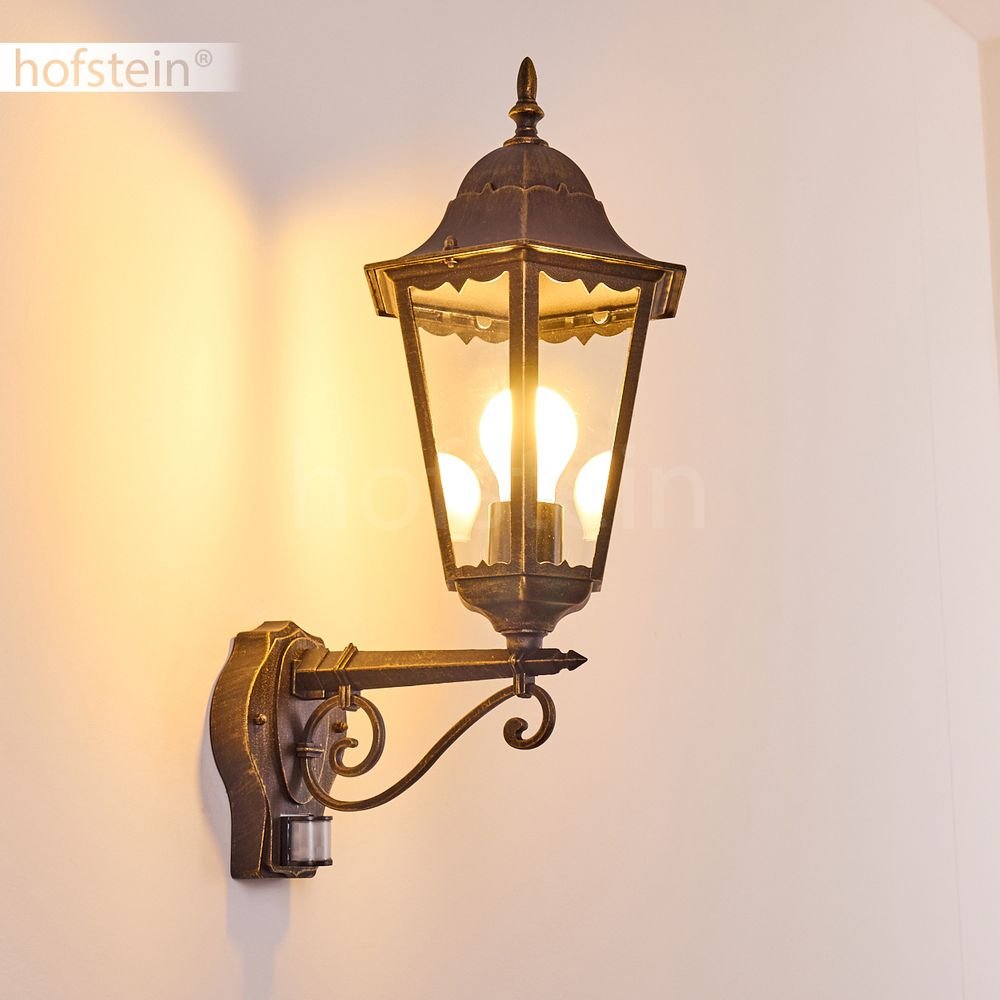 Zewnętrzna lampa ścienna Hong Kong z czujnikiem ruchu, lampa ścienna w górę, odlew aluminiowy w kolorze brązowym/złotym z przezroczystymi szybami, lampa ścienna na taras/podwórko, E27, bez żarówki