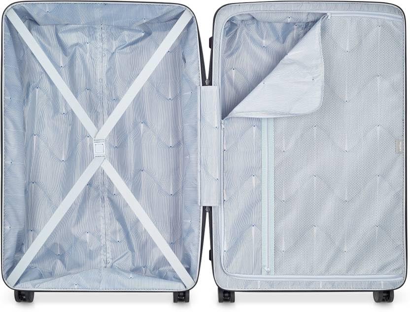 Interior view of DELSEY PARIS ORDENER luggage showing packing straps and zippered compartment