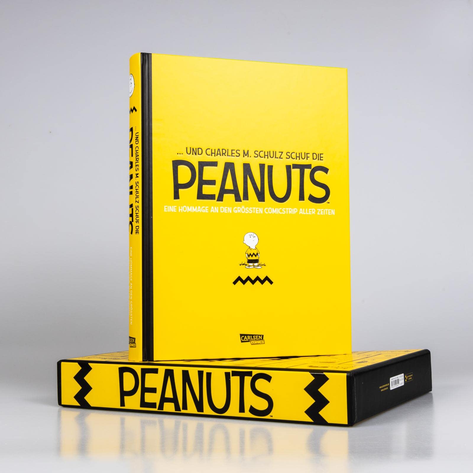 ... Und Charles M. Schulz schuf die Peanuts: Eine Hommage an den größten Comicstrip aller Zeiten | Hochwertige Luxusausgabe im Schuber (Peanuts Deluxe)
