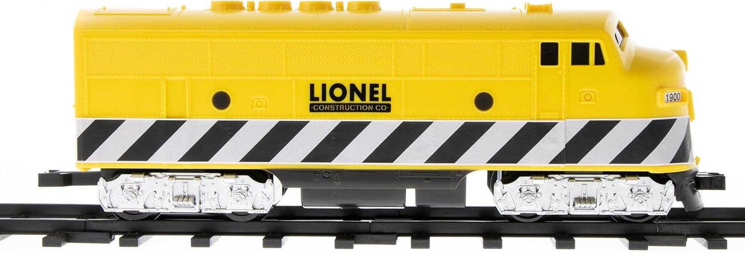 Close-up of the yellow diesel locomotive on the track.