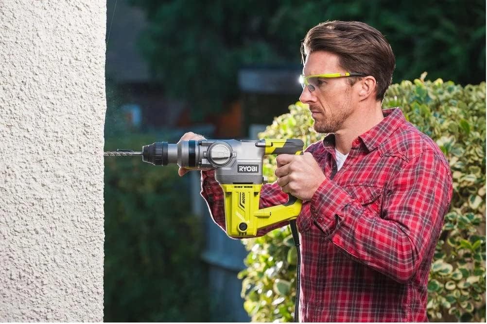 Ryobi SDS-Plus Rotary Hammer Drill RSDS1050-K with auxiliary handle attached, showing the front of the tool.