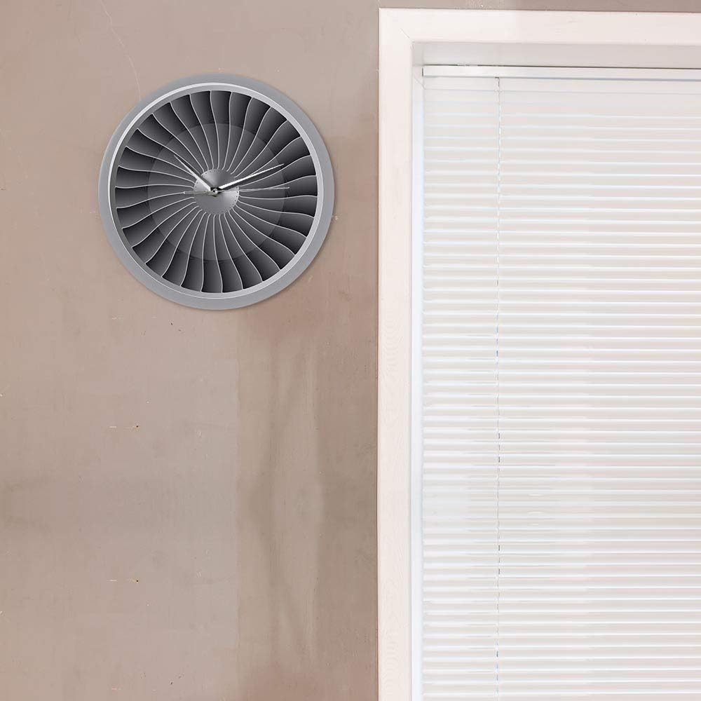 ELD Aviator Wall Clock mounted on a wall next to a window, showing its decorative placement.
