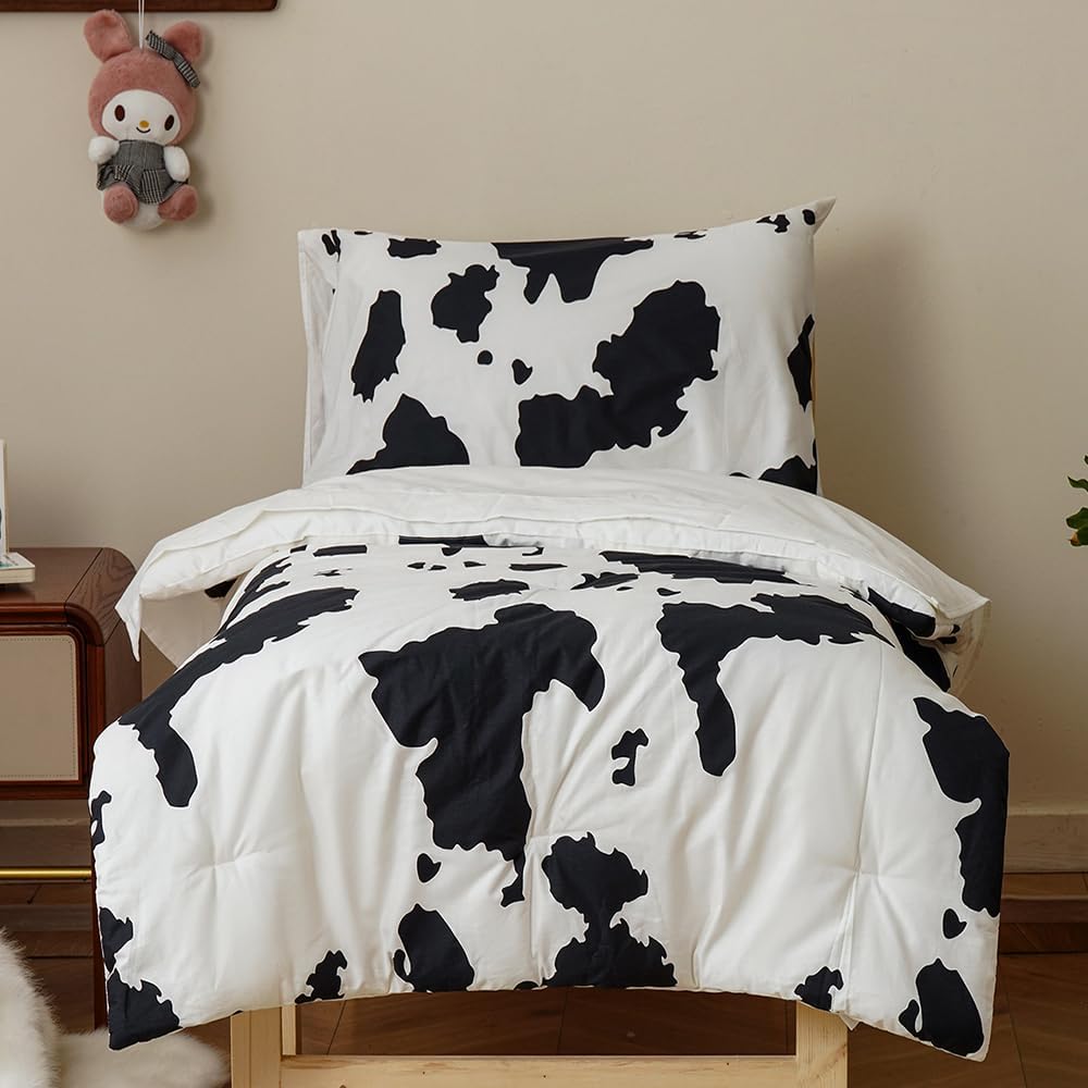 CLOTHKNOW 4Pieces Black White Cotton Toddler Bedding Sets for Boys Girls, Cute Cow Pattern, Soft Crib Bed Set Including Comforter, Flat Sheet, Fitted Sheet and Pillowcase