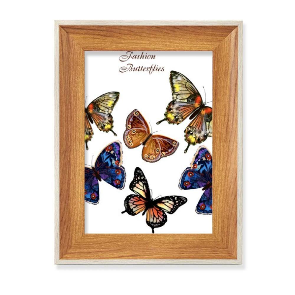 Ailes de papillons sur un tableau art peinture de bureau en bois