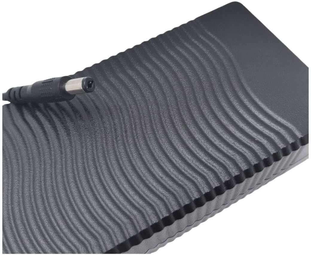 Top view of SPEDWHEL Kukirin G4 charger showing textured surface and output cable