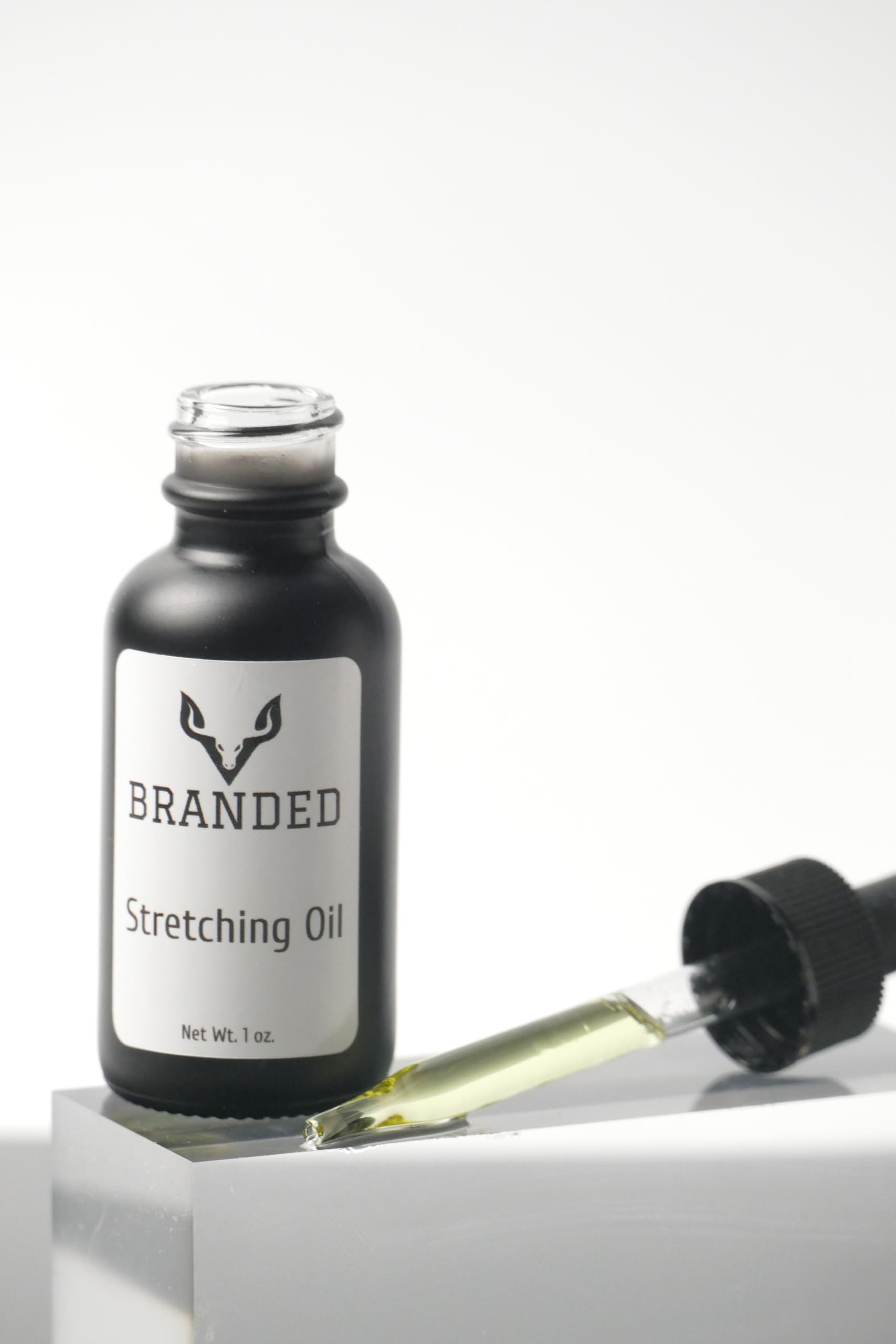 Amazon.com: Branded Ear Stretching Oil, Piercing Aftercare. Stretch  Lubricant for Plugs and tapers.