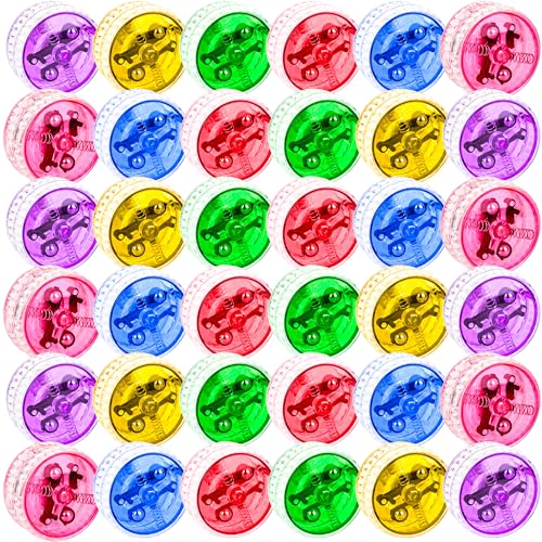 a row of yo-yos in six bright colors, one lit up with a glowing core
