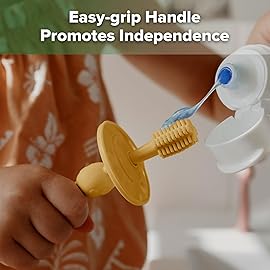 haakaa 360 Baby Toothbrush with Suction Base - Gentle Cleaning for Toddler\'s Self-Brushing Training, Food-Grade Silicone, Adjustable Safety Shield - Mustard (1 Piece)