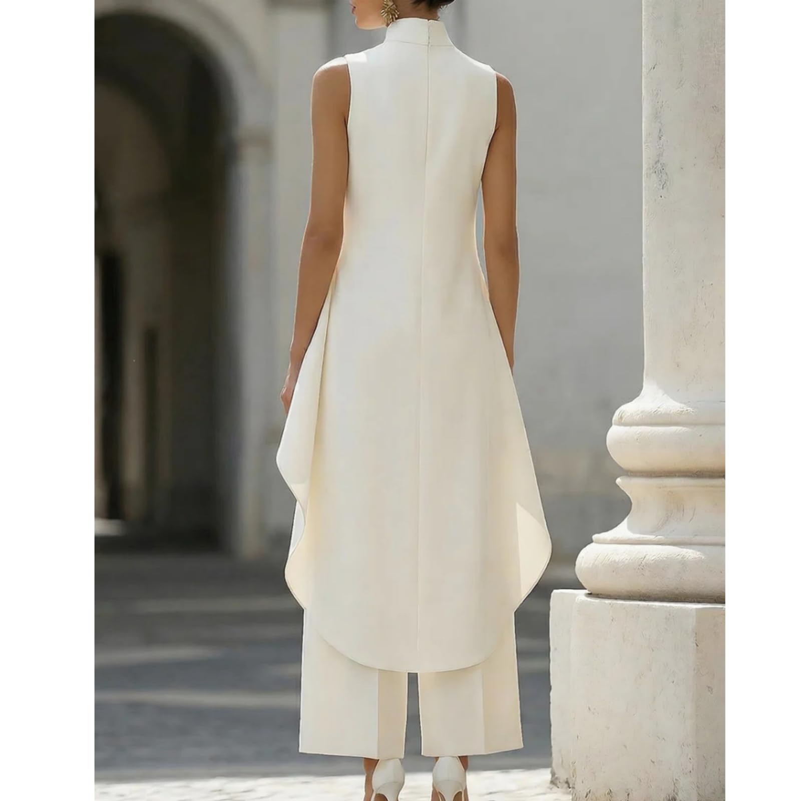 Generico Completo da donna a due pezzi senza maniche, composto da un elegante top asimmetrico a collo alto e pantaloni a gamba larga.
