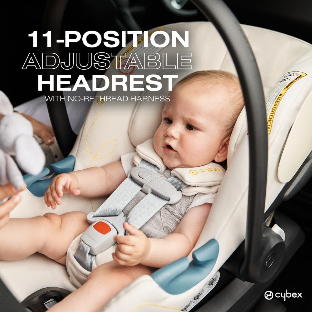 Close-up of a baby in the Cybex Aton G car seat, highlighting the 11-position adjustable headrest and no-rethread harness