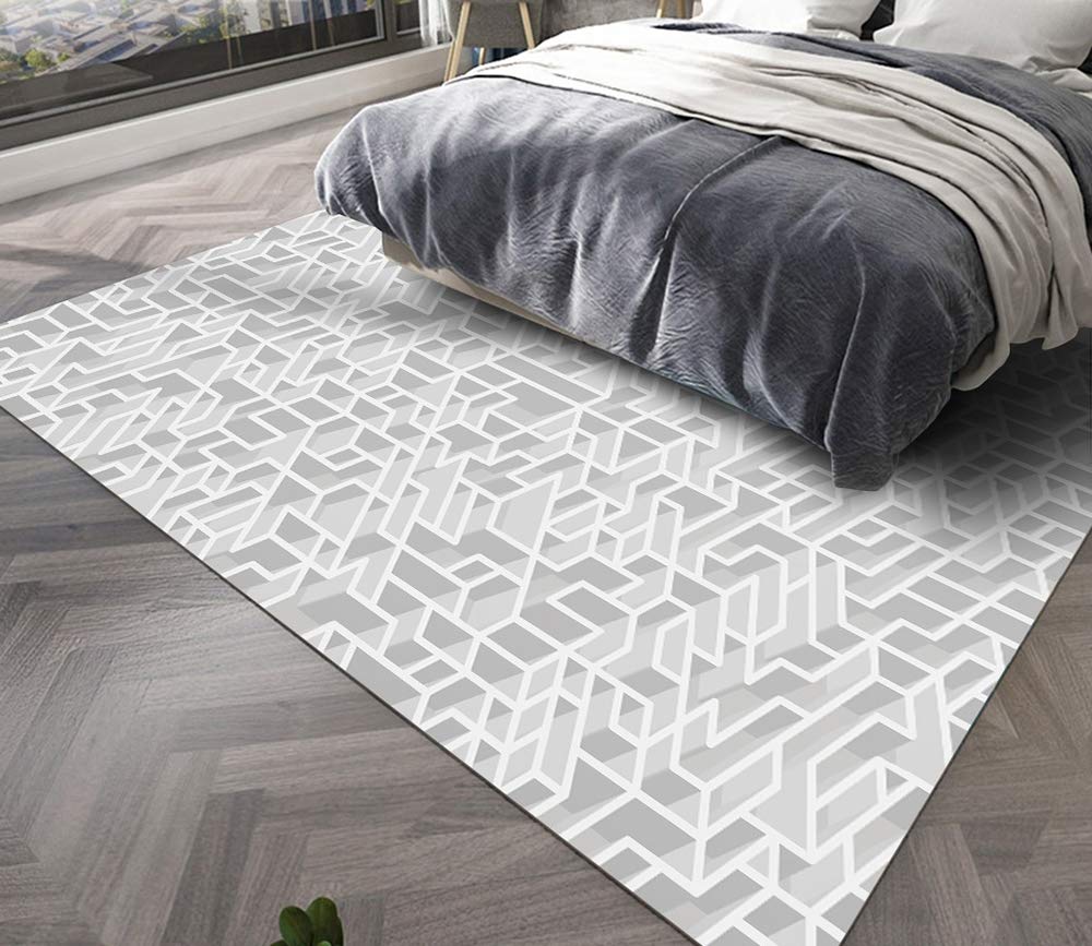 Tapis ménager géométrique en velours pour un salon minimaliste noir et blanc
