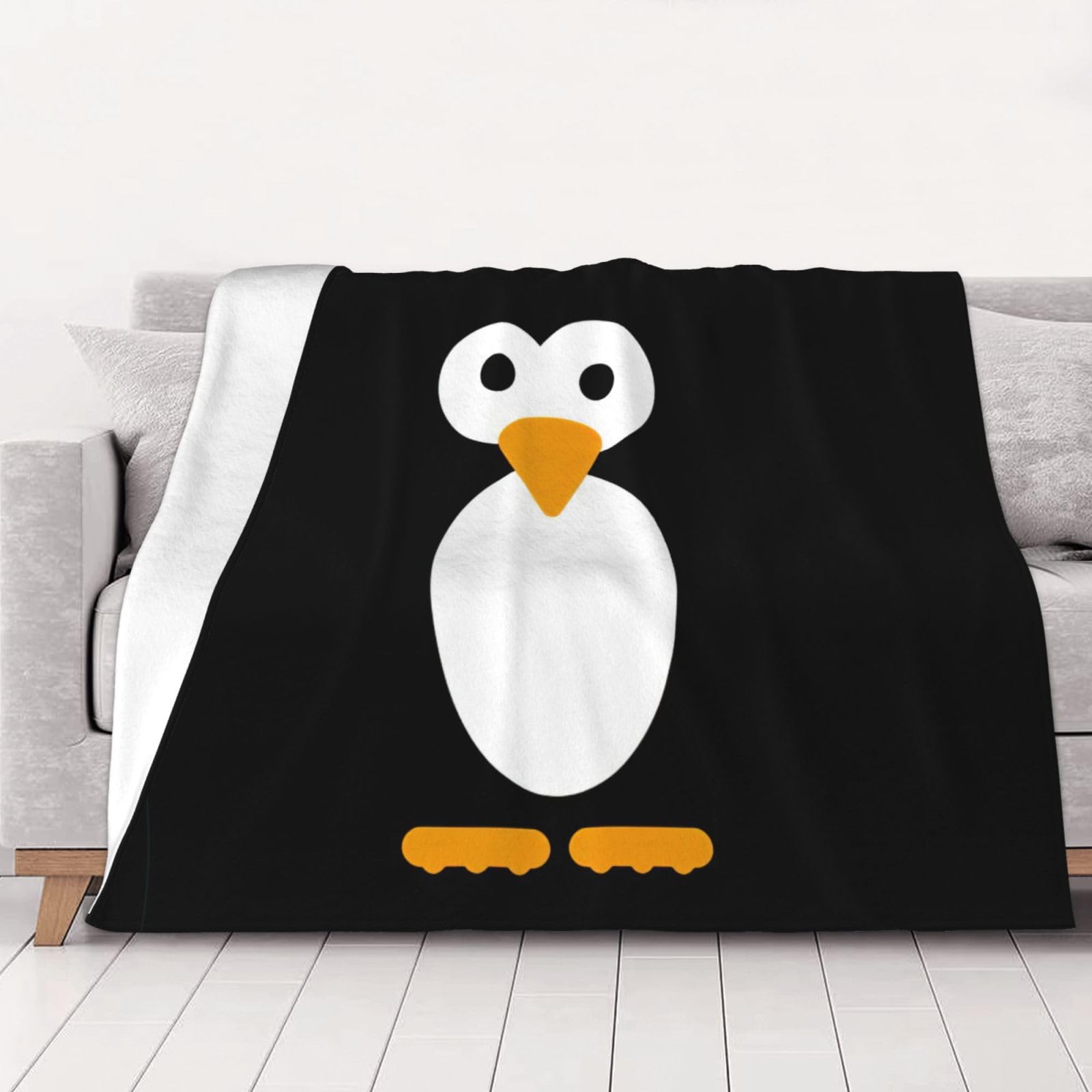 Couverture flanelle pingouin pour vos soirées cocooning sur le canapé